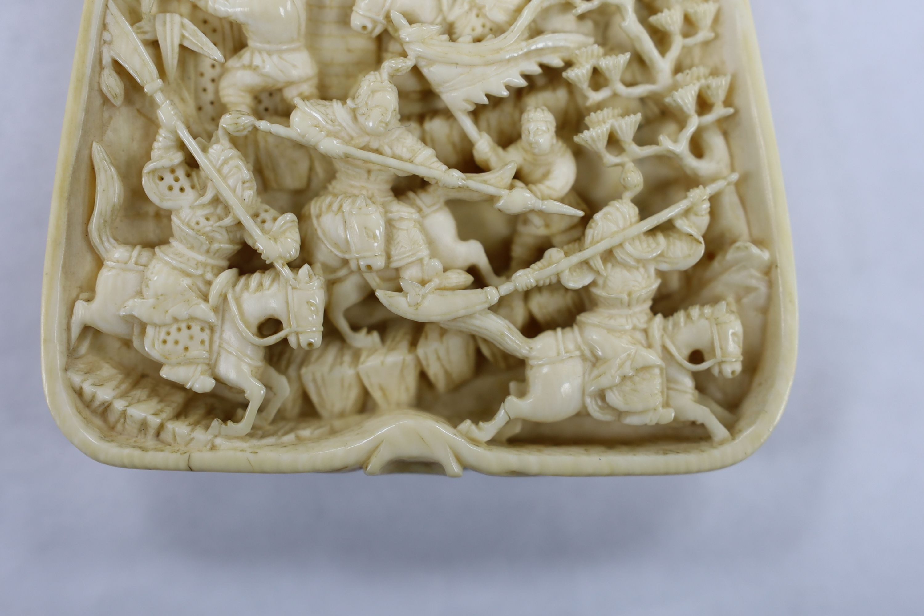 A 19th century Chinese ivory carving, warrior scene, 13cm high